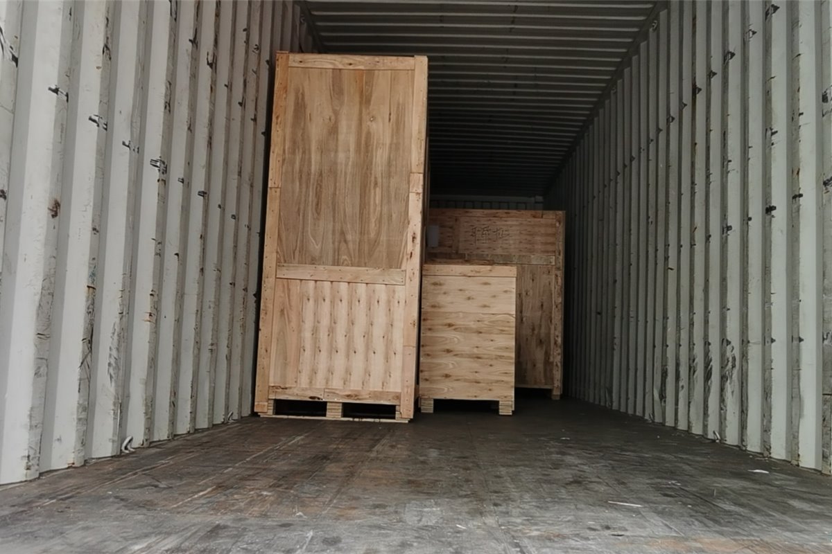 Wooden crate loading in container